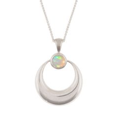 This minimalist crescent moon pendant is simple and elegant. I've carved the pendant in wax, then cast it in solid sterling silver. I have then finished it to a mirror shine before hand setting a gorgeous Ethiopian Welo Opal. The pendant measures 22mm wide by 30mm tall. Stones measure 6mm. Comes with an 18 inch sterling silver spiga chain. You can find the matching earrings here: https://www.etsy.com/listing/265447793/sterling-silver-crescent-moon-earrings?ref=shop_home_active_1 Insured US shipp Celestial Crescent Sterling Silver Jewelry, Celestial Silver Oval Pendant Jewelry, Celestial Silver Oval Necklace, Silver Oval Celestial Necklace, Engraved Sterling Silver Crescent Jewelry, Crescent White Gold Sterling Silver Necklace, Crescent Shaped White Gold Sterling Silver Necklace, Crescent Shaped White Gold Necklace In Sterling Silver, White Gold Crescent Necklace In Sterling Silver