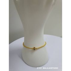 This exquisite chain bracelet is a handmade ethnic. Thai piece of jewelry made from yellow gold plated brass with tiny and cute bead enamel. The bracelet is perfect gift for all occasions. The unique design and style of this bracelet make it suitable for women of all ages. The bracelet is made in Thailand and is perfect for those who loves ethnic, regional, and tribal jewelry. Material: Brass gold plated23K with enamel Color : Yellow Gold  Weight : 45.48 grams Size: 6.5 inches, 7 inches, 7.5 inches Quantity : 1 pc You will receive : gold case, gift bag, wishes card Handmade, Exquisite craftsmanship Note to buyer: >The picture is enlarged. Please check the size and consider from the illustrations. >The necklace is delicate necklace. You may use it with special care. >The price do not cover Dainty Handmade Gold Beaded Bracelets, Handmade Gold Bracelet With Round Beads, Dainty Handmade Gold Chain Bracelet, Gold Dainty Handmade Chain Bracelet, Handmade Gold-plated Beaded Bracelets, Handmade Yellow Gold Plated Beaded Bracelets, Adjustable Tiny Beads Gold-plated Jewelry, Gold Bracelets With Simple Design For Gift, Dainty Handmade Gold Charm Bracelet