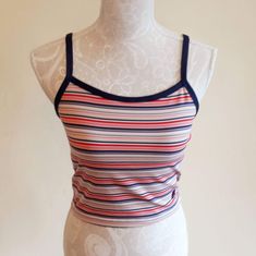 "Sweet vintage Champion sports crop top. Colorful stripes,blue suspenders and a edge around the sleeve. It has a logo printed at the end. Fabric is stretchy. It is padded on the chest,see last image. In excellent vintage condition. Tag size: US M,but smaller,best fits to size US XS/S,check the measures. Materials: polyester 88%,spandex 12% Label: Champion  Measures taken flat,one side bust 36.5 - 48 cm = 14,37 - 18,90\" waist 34 - 37 cm = 13,38 - 14,57\" length with suspenders about 43 cm = 16,9 Striped Fitted Tops With Tank Straps, Fitted Striped Tops With Tank Straps, Sporty Cropped Tops With Adjustable Straps, Striped Fitted Tank Top With Tank Straps, Blue Sporty Top With Adjustable Straps, Summer Sports Tops With Contrast Stripes, Summer Sports Top With Contrast Stripes, Fitted Striped Tank Top, Fitted Blue Top With Contrast Stripes