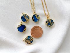 Dainty Sapphire Coin Medallion Pendant Necklace Add a new twist to the classic Sapphire Necklace with these stunners! Features Sapphire Gemstones that are circle cut and framed in gold electroplating. Each medallion pendant is similar, yet unique - making these one of kind. Stones are double sided. *Pendant size is approximately 12mm {Stones will be randomly selected and crafted into your one of a kind necklace. No two pendants are exactly alike} Hangs on your choice of chain: 14k Gold Plated Li Gold Mermaid, Coin Pendant Necklace, Medallion Necklace, Sapphire Necklace, Coin Pendant, Sapphire Gemstone, Gold Filled Chain, Blue Crystals, Gold Plated Jewelry