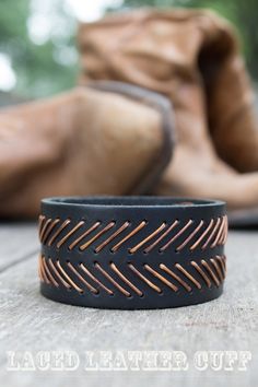 a close up of a black leather bracelet