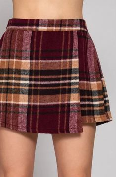 Add a playful twist to your fall wardrobe with our Front Wrap Rustling Plaid Mini Skort. Featuring a brushed plaid design in rich burgundy and taupe, this skort is the perfect combination of style and comfort. Embrace the fall season in the perfect way! Fabric: 95% Polyester, 5% Wool Taupe Color Schemes, Skirts Wrap, Skirt And Sneakers, Estilo Chic, Activewear Sets, A Skirt, Taupe Color, Sewing Project, Tee Dress