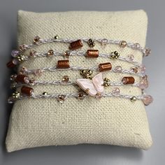 Women's Wrap Bracelet Light Gray Gold Blush Pink Beads Butterfly Handmade Cute Perfect For The Butterfly Lover. One Of A Kind Wrap Bracelet With Button Closure. Great Lightweight Piece To Wear Layered With Other Accessories. Very Versatile, Shown As An Anklet As Well. Makes A Great Gift. 38 In. Total Length. Designed And Handmade In Las Vegas, Nevada I'd Love To Accept Your Offer! Smoke-Free Seller. Fast Shipping. Trusted Long-Time Seller. All Items Are In Euc Unless Otherwise Stated. Thank You Adjustable Pink Gold Beaded Bracelets, Adjustable Pink Gold Beaded Bracelet, Multi-strand Beaded Bracelets For Jewelry Making, Adjustable Pink Multi-strand Beaded Bracelets, Pink Adjustable Multi-strand Beaded Bracelets, Beaded Wrap Bracelet As Gift, Adjustable Multi-strand Pink Jewelry, Pink Hand-wrapped Bracelets With Round Beads, Adjustable Pink Beaded Jewelry