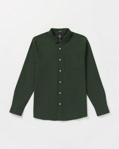 Crafted from soft, breathable 100% cotton, this button-down Oxford shirt delivers a timeless style with a left chest pocket and a button-down collar detail. Comfortable and versatile, it's a wardrobe essential you'll reach for over and over again. Featured here in green. - 
 - 100% Cotton oxford
 - Classic fit
 - Left chest pocket
 - Novelty logo buttons
 - Two color Volcom word embroidery at chest pocket Word Embroidery, Flannel Jacket, Dark Forest, Oxford Shirt, Long Coat, Timeless Style, Chest Pocket, Denim Dress, Wardrobe Essentials