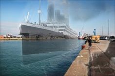 there is a large ship in the water next to a dock with people walking on it