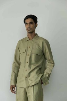 Description: Our commitment to craftsmanship results in refined staples like this overshirt. It's designed with utility-inspired details, such as the flap, patch and welt pockets and topstitching. The sleeves feature exaggerated cuffs. Layer yours over basic tees or pick from our range of shirts.Product Details: Relaxed fit Wide placket Long cuffed sleeves Color: Moss GreenFabric: Hemp Cotton 55% hemp & 45% cotton Made in India Size & Fit: Height: 6.1 ftModel is wearing size SFit: RelaxedGarment Drip Dry, Green Fabric, Basic Tees, Cuff Sleeves, Welt Pockets, Welt Pocket, Relaxed Fit, India, Range