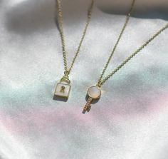 Celebrate unbreakable bonds with our Mother-of-Pearl and Gold Lock and Key Necklace Set. Crafted for those who cherish deep connections, each piece is delicately designed to symbolize a timeless bond of trust and loyalty. This minimalist and dainty set is ideal for couples or best friends who appreciate simplicity and meaning in their jewelry. Mother-of-Pearl is believed to attract prosperity and heighten intuition, sensitivity and imagination. When sunlight catches the pearl, it glows iridescently.  The set can be gifted to friends, family or romantic partners, or worn by yourself as a layered necklace set. Each necklace is adjustable and can be worn between 16-18 inches. 🌼 Our Guarantees: -Customers are offered a 2 month product guarantee, if anything happens with your product that lead Lock And Key Necklace, Elegant Heart-shaped Necklace With Two Keys, 2pcs Lock Charm & Necklace, Friendship Jewelry, Layered Necklace Set, Lock And Key, Key Necklace, Layered Necklace, Matching Necklaces