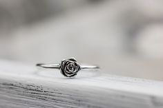 Someone once said that flowers are God's sweetest creations without a soul, and we couldn't agree more and the rose is the most beloved flower of all time. Roses symbolize love and happiness. This dainty rose ring is the perfect way to express your love, friendship or admiration for your beloved! Crafted from sold sterling silver. This ring is beautiful on its own or looks lovely stacked with my sterling silver vine ring linked below. ✥ Sterling Silver ✥ Available in sizes 3-10 ✥ Beautifully box Sterling Silver Rings Aesthetic, Dainty Rose Design Flower Ring For Gift, Rose Design Rings For Valentine's Day, Dainty Rose Design Flower Ring For Anniversary, Dainty Rose Design Flower Ring Gift, Dainty Rose Design Flower Promise Ring, Flower Shaped Rings With Roses For Gift, Dainty Rose Colored Rings As Gift, Adjustable Rose Design Flower Ring For Anniversary