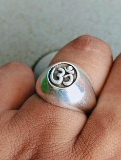 This is a listing of Om sterling silver Ring , this is very unique ring for your love ones. This ring is made on base of INDIAN GOD SHIVA It is a Very unique Ring, You will love it and It look more amazing in your Hand. It would make a very special gift for somebody you love! Metal = Silver Material :- 925 Sterling Silver Ring Size - Available in all Size Band Color - silver Handmade Crafting bohemian Ring - This style has bohemian style . it will look beautiful when you wear it .. Thanks for vi Symbolic Toe Rings For Anniversary, Spiritual White Gold Ring Stamped 925, Symbolic Sterling Silver Rings With Polished Finish, Nickel Free Spiritual Rings For Anniversary, Symbolic Sterling Silver Signet Ring For Wedding, Sterling Silver Hallmarked Dome Ring As A Gift, Symbolic Engraved Ring Stamped 925 For Promise, Symbolic Nickel-free Rings For Anniversary, Hallmarked Sterling Silver Dome Ring As A Gift