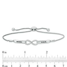 Celebrate your forever romance with this Personalized diamond infinity bolo bracelet. Fashioned in sterling silver, this romantic design showcases a shimmering diamond-lined infinity symbol shape between two elongated plaques. Complete this look with the two names or phrases of your choice - each up to seven characters in length - inscribed in an attractive uppercase print font. Radiant with 1/15 ct. t.w. of diamonds and a bright polished shine, this easy-on wheat chain bracelet adjust up to 9.5 inches in length and secures with a bolo clasp and ball ends. Elegant Silver Bracelets For Anniversary Gift, Silver Diamond Name Bracelet For Anniversary, Silver Name Bracelet With Adjustable Chain For Anniversary, Adjustable Infinity Fine Jewelry, Infinity Diamond Bracelet With Accents For Anniversary, Anniversary Diamond Bracelet With Infinity Design, Classic Adjustable Infinity Jewelry, Infinity Diamond Bracelet For Anniversary, Elegant Personalized Adjustable Diamond Bracelet