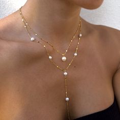 "Our gorgeous freshwater pearl necklaces make the perfect bride, bridesmaid, friend, family gifts. Delicately and carefully handmade with the most excellent and sparkling chain. The dainty minimalist chain dazzles along with our freshwater pearls.  We have the single pearl necklaces or long lariat-style necklace. Each are sold separately.  Wedding/Bridesmaids Discounts:  We offer discounts for multiple pieces, just send us over a message and we will gladly help! We can also put together a gorgeous gift box for your loved ones.  Single Pearl Necklace Length: 16 inches with extra 2\" chain extender Material: Stainless Steel Finish: 18K Gold Plating / Platinum Plating -  PROCESSING TIME -  This piece is handmade to order and is ready to ship in 1-2 business days.  - ABOUT MINKKSI -  https://w Boho Bride Necklace, Long Y Necklace, Graceful Pearl Jewelry For Party, Delicate Jewelry For Mother's Day Party, Delicate Party Jewelry For Mother's Day, Delicate Mother's Day Party Jewelry, Dainty Pearl Drop Necklace For Party, Elegant Adjustable Bridal Necklace With Pearl Charm, Elegant Adjustable Necklace For Wedding