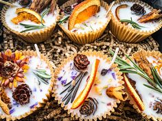 some cupcakes with frosting and pine cones on them are arranged in the shape of flowers