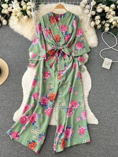 Floral Print Green Wrap Kimono Belted Casual Jumpsuit Green Floral Print Jumpsuit For Vacation, Chic Green Printed Jumpsuits And Rompers, Green Floral Print Jumpsuit For Beach, Beach Jumpsuits And Rompers With Floral Print, Casual Green Spring Jumpsuits And Rompers, Casual Green Jumpsuits And Rompers For Spring, Green Floral Print Jumpsuits And Rompers For Spring, Green Floral Print Jumpsuits And Rompers For Brunch, Floral Print Jumpsuits And Rompers For Garden Party