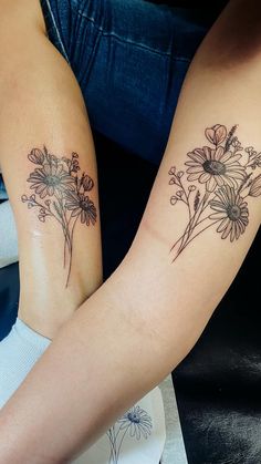 two people with matching tattoos on their arms