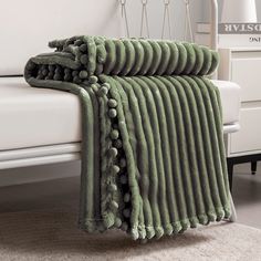 PRICES MAY VARY. 【Pompom & Strip Design】- Flannel fabric with pompoms fringe around the blanket, different color and white stripe pattern with 3D touching offers you amazing senses of softness. The fabulous color revives this blanket with an elegant appearance to complement your room a chic feeling. 【Soft & Lightweight】- The throw we offered is designed to be simple but elegant, this plush throw is super soft, warm and lightweight. Fleece bed blanket brings you more breathable and lightweight fe Amped Fleece Throw Blanket, Chunky Throw Blanket Green, Bedroom Throw Blanket Pattern, Neutral Bedding With Throw Blanket, Sage Green Throw Blanket Knit, Grey Green Throw Blanket, Plain Throw Blanket, Green Knit Pillow, Green Throw Pillow Bedroom