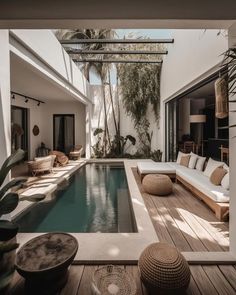 an indoor swimming pool in the middle of a house