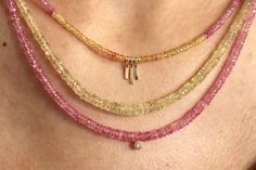 Small faceted pink and yellow sapphire necklace with 14k yellow gold clasp and dangle bars necklace Sapphire beads 2mm Small 14k yellow gold beads 2mm 14k yellow gold clasp and gold filled crimp bead covers 14k yellow gold bars- 2 smaller 1.5mm x 6mm & longer bar 1.5mm x 8mm Necklace approximately 16 1/2" long 14k Gold Single Strand Jewelry With Round Beads, Handmade 14k Gold Pink Jewelry, Dainty Single Strand Pink Jewelry, Handmade Pink 14k Gold Jewelry, Dainty Yellow Jewelry With Tiny Beads, Dainty Dangle Jewelry With Gemstone Beads, Fine Jewelry With Single Strand Rondelle, Fine Jewelry Single Strand Rondelle, Pink Double Strand Gemstone Beads Jewelry