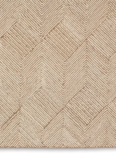 an area rug that is made up of beige herringbones