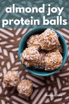 a blue bowl filled with almond joy protein balls