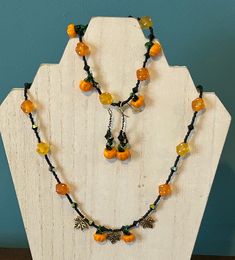 3 pc set Pumpkin, fall, autumn lover jewelry set. Glass beads with metal leaves scattered in between beads. Necklace is 21" with a toggle clasp. The bracelet is 9" with a twist clasp and then a pair of matching pierced earrings. Fall Themed Beaded Jewelry, Fall Themed Jewelry, Bohemian Adjustable Jewelry For Fall, Adjustable Bohemian Jewelry For Fall, Handmade Adjustable Jewelry For Fall, Handmade Dangle Jewelry For Fall, Adjustable Handmade Jewelry For Fall, Pumpkin Bead Bracelet, Halloween Orange Round Bead Jewelry