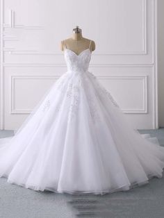 $230.25 -   Key Features: Item Type: Wedding Dresses Sleeve Style: Spaghetti Straps Built-in: Yes Decoration: Appliques Decoration: Lace Neckline: Sweetheart Sleeve Length(cm): Sleeveless Wedding Dress Fabric: Organza and Tulle is_customized: Yes Silhouette: Ball Gown Waistline: Natural Back Design: zipper Fashion Element: simple Actual Images: Yes Brand Name: Bridelily Train: Chapel Train Plus Size: Yes Dresses Length: Floor-Length Color: White / ivory /custom Any questions about the item, feel White V-neck Dress For Debutante Ball, Tulle Ball Gown With Spaghetti Straps For Debutante Ball, Wedding Dress With Sweetheart Neckline And Delicate Straps, White V-neck Wedding Dress With Lace Bodice, Wedding Tulle Dress With Spaghetti Straps, Wedding Dress With Spaghetti Straps And Sweep Train, White Sweetheart Neckline Ball Gown For Bridesmaid, Wedding Dresses With Delicate Lace Straps, Delicate Lace Dresses With Straps For Wedding