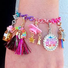 Show them how much you believe in them and support their dreams with a charm that inspires (and states the facts)! Add this charm to any CHARM IT! bracelet or necklace and customize her collection! features & materials Enamel, Glass, Base Metal WARNING: Choking Hazard - Small parts. Not for children under 3 years. Novelty Multicolor Charm Bracelet, Personalized Pink Novelty Charm Bracelet, Fun Personalized Dangle Jewelry, Friendship Novelty Charm Bracelet, Playful Dangle Personalized Jewelry, Themed Multicolor Jewelry With Charms, Multicolor Personalized Novelty Charm Bracelet, Multicolor Themed Jewelry With Charms, Personalized Multicolor Novelty Jewelry