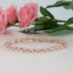 This charming stretch bracelet features the warm, enchanting hues of strawberry quartz and the luxurious shine of 14K gold filled beads. Key Features: Warm Strawberry Quartz Beads: Each strawberry quartz bead showcases rich, reddish-pink tones with a hint of sparkle. Known for its uplifting energy and beauty, strawberry quartz brings warmth and a unique charm to the bracelet. Luxurious 14K Gold Filled Beads: Interspersed between the strawberry quartz beads, the 14K gold filled beads provide a ri Elegant Rose Quartz Stretch Bracelet With Round Beads, Gold Rose Quartz Beaded Bracelets, Gold Rose Quartz Beaded Bracelets With Round Beads, Gold Beaded Bracelets With Rose Quartz Round Beads, Gold Beaded Bracelets With Rose Quartz, Gold Beaded Bracelet With Rose Quartz Round Beads, Elegant Pink Beaded Bracelets With Gold Beads, Elegant Gold Beaded Bracelets With Rose Quartz, Elegant Pink Stackable Stretch Bracelet