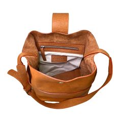 Andes is a deep, bucket style bag; everything you need for a busy day. It features a large unlined main compartment, with a magnetic closure and an inner zippered pocket. On the outside, it has three flat pockets to keep essentials handy. Adjustable strap makes it perfect to use as a shoulder bag or across your body. It is made with 100% Argentinian vegetable tanned leather, which makes it extremely smooth and soft to the touch. Available in caramel. Dimensions: 9'(width) x 12' (height) x 6' (de Luxury Bucket-shape Shoulder Bag For On-the-go, Modern Bucket Bags For On-the-go, Modern Bucket Bag With Leather Handles For On-the-go, Luxury Large Capacity Bucket Bag For On-the-go, Versatile Satchel Bucket Bag With Adjustable Strap, Versatile Crossbody Bucket Bag With Removable Pouch, Leather Bucket Satchel For On-the-go, On-the-go Bucket Bag With Removable Pouch, Daily Use Bucket Bag With Detachable Strap