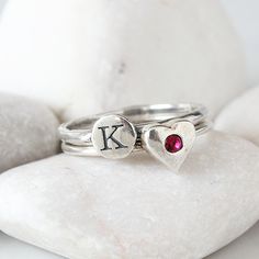 "Know someone with an January birthday ~ this is the perfect gift! Stackable birthstone rings are the IT accessory. Wear by itself or pair with with an initial ring! This listing is for one sterling silver stackable birthstone ring with a Swarovski crystal (please see color chart for color selection). Round, square, rectangle, marquise, heart or cross shapes available. Also available in January, February, March, April, May, June, July, August, September, October, November, or December here: http Stackable Rings With May Birthstone For Birthday, Gift Stackable Rings With Bezel Setting For May Birthstone, May Birthstone Stackable Rings With Bezel Setting, Stackable Bezel-set Rings For May Birthstone Gift, Silver Heart-shaped Birthstone Ring Gift, Silver Heart Ring For May Birthstone Gift, Stackable Round Birthstone Ring For Birthday, Silver Birthstone Ring With Round Stone For Gift, Silver Initial Ring For Valentine's Day Gift