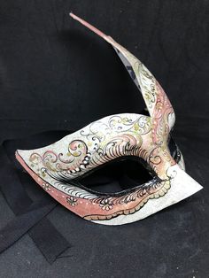 Traditional and original papier-machè Venetian mask, handmade and decorated with acrylics colors. All our masks are handmade papier-machè masks made in Venice. Our decorators use techniques typical of the Venetian tradition such as stucco, acrylics, gold and silver-leaf, macramè, passementerie, pearls and crequelè to give you a wide range of masks. This shape is available in many different designs, colors and techniques. Ask us to personalize your mask! We ship worldwilde with GLS, DHL and Fedex Paper Mache Mask, Mask Ideas, Costume Masks, Venetian Mask, The Venetian, Costume Mask, Mask Making, Acrylic Colors, Paper Mache