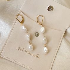 Handcrafted • Waterproof • Tarnish Resistant • Hypoallergenic 3 white Keshi freshwater pearls hand strung on 14k gold filled wire and earring hooks. 14k Gold Filled Pearl White Dangle Pearl Earrings, Dainty Pearl White 14k Gold Filled Pearl Earrings, Pearl White Dangle Earrings For Everyday, Adjustable 14k Gold-filled Jewelry With Pearl Drop, Adjustable 14k Gold-filled Pearl Drop Jewelry, Handmade White Pearl Earrings In 14k Gold Filled, Pearl White Earrings With Pearl Charm In 14k Gold, 14k Gold-filled Pearl White Earrings With Pearl Charm, Everyday 14k Gold Filled Pearl Chain Earrings