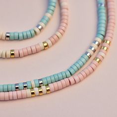 Bring alllllll the beach vibes anywhere you go with our Sealife Necklace. This beaded beauty comes in two sweet shades—a sand-inspired pink and sea-inspired turquoise—plus pops of silver or gold for a mini dose of shine. - Turquoise: brass base with rhodium plating & synthetic howlite beads- Sand: brass base with gold plating & synthetic howlite beads- Chain: 14" with 2" extension. Jump ring at 1" of extension.- Because jewelry products are handcrafted by artisans, dimensions may vary from piece Summer Beaded Necklace Pura Vida, Cheap Turquoise Beach Jewelry, Cute Cheap Beach Necklaces, Surf Necklace Pura Vida, Cheap Oval Beads Necklaces For Beach, Seed Bead Necklace Pura Vida, Cheap Casual Beach Necklaces, Cheap Beaded Necklaces For Beach Season, Cheap Casual Necklaces For Beach Season