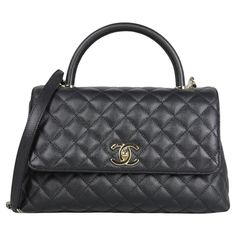 Chanel Black Caviar Leather Quilted Small Coco Handle Flap Bag Made In: Italy Year of Production: 2021 Color: Black Hardware: Pale goldtone Materials: Caviar leather Lining: Leather Closure/Opening: Flap top with CC twist lock Exterior Pockets: Back patch pocket Interior Pockets: Two compartments separated by zipper pocket, patch pockets, and a central zipper compartment. Exterior Condition: Excellent Interior Condition: Excellent Includes: Dustbag, tag Measurements: 11.25"L x 7"H x 4.5"D Handle Drop: 3.25" Strap Drop: 19.25" Coco Handle, Favorite Handbags, Black Caviar, Chanel Black, Black Hardware, Flap Bag, Patch Pocket, High Jewelry, Fashion Handbags