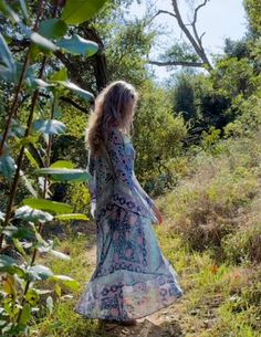 Indulge in the ethereal beauty of our Audrey Maxi Dress with Butterfly Sleeves in Blue. This stunning piece is crafted from 100% Indian cotton, making it soft and comfortable against your skin. The intricate butterfly sleeves add a touch of whimsy and romance, making you feel like a true goddess. The dress features a beautiful blue print that will transport you to a dreamy paradise. The flowy maxi length adds a touch of elegance and grace to your every step. Whether you're strolling along the be Ethereal Beach Dress For Spring, Ethereal Spring Beach Dress, Long Hippie Boho Dress For Spring, Bohemian Maxi Dress With Bell Sleeves, Flowy Long Sleeve Boho Dress For Festival, Bohemian Flowy Maxi Dress With Bell Sleeves, Bohemian Flowy Bell Sleeve Maxi Dress, Flowy Bohemian Maxi Dress With Bell Sleeves, Long Boho Dress For Spring Festival