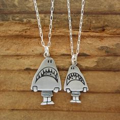 This cute set is a fun gift for your friends with kids. They are made from sterling silver, the mom measures 3/4" high and the daughter 1/2" high.  The daughter hangs from a 16" silver-plated cable chain and the mom hangs from an 18" silver-plated cable chain.If you have two kids:https://www.etsy.com/listing/87244713/two-kids-famiy-necklaceTo see the larger necklace click here:https://www.etsy.com/listing/517944382/sterling-shark-girl-necklace-cute-silverTo see the smaller necklace click here:ht Cute Sterling Silver Pendant Charm Necklace, Cute Silver Sterling Silver Charm Necklaces, Cute Sterling Silver Pendant Charm Necklaces, Playful Silver Jewelry For Friendship, Fun Silver Jewelry For Friendship, Fun Nickel-free Jewelry For Friendship, Cute Nickel-free Charm Necklace For Friendship, Handmade Cute Charm Necklaces For Mother's Day, Playful Silver Charm Necklaces