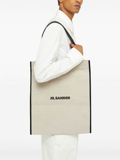 beige black cotton blend rectangle shape two leather top handles internal leather pocket internal note compartments cotton linen canvas logo print to the front This item is in size UNI and the color is Jil Sander Bag, Shopping Online Logo, Medium Tote Bag, Leather Pocket, Bags Logo, Linen Canvas, Medium Tote, Jil Sander, White Bag