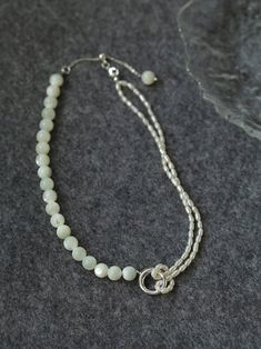 This stunning necklace features an elegant blend of 8mm natural white mother-of-pearl and delicate millet pearls, creating a chic half-and-half design that is both eye-catching and fashionable. With its sophisticated yet modern aesthetic, this piece brings an air of elegance and grace to any outfit. Whether paired with a dress, blazer, or knitwear, it adds a soft and refined touch, making it the perfect accessory for a variety of styles. Metal: Recycled Sterling Silver Plated On Brass Material: Adjustable Mother Of Pearl Necklace With Pearl Pendant, Adjustable Mother Of Pearl Necklace With Pendant, Elegant Double Strand Beaded Necklace With Pearl Charm, Elegant Pearl White Necklace With Polished Beads, Elegant White Mother Of Pearl Bracelet, Adjustable Mother Of Pearl Necklace With Pearl Charm, Adjustable Pearl White Mother Of Pearl Necklace, Elegant Pearl Bracelet With Polished Beads, Elegant Adjustable Pearl Necklace With Gemstone Beads