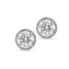 She'll feel completely special in these spectacular diamond halo stud earrings. Crafted in cool 18K white gold, each earring features a 2.5ct. brilliant cut round diamonds - artfully set to enhance size and sparkle - wrapped in a frame of smaller diamonds. Shimmering with 5.31 ct. t.w. of diamonds and a brilliant buffed luster, these post earrings secure comfortably with a protector squeeze back. 
2.54 carat F SI2 
2.50 carat F SI1
0.27 carat white di Emerald Earrings Drop, 3 Carat Diamond, Halo Stud Earrings, Halo Earrings Studs, Orange Sapphire, Pave Setting, Tennis Bracelet Diamond, Diamond Stud Earrings, Diamond Stud