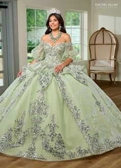 Light up the room in this beaded applique long off shoulder puff sleeve dress with A-line skirt by Rachel Allan RQ3128. Discover elegance and grace in this tulle ballgown. This romantic ballgown radiates with sophistication and is sure to leave a lasting impression. The off-the-shoulder neckline is hand beaded with applique and fringed detailing, adding a regal look to the entire silhouette. Detachable tulle sleeves provide a subtle vintage touch and a lace-up back offers the ultimate fit. As yo Mint Green Quinceanera, Mint Green Quinceanera Dresses, Off Shoulder Puff Sleeve Dress, Detachable Tulle Sleeves, Quinceanera Dresses Off The Shoulder, Green Quinceanera Dress, Green Quinceanera, Green Quinceanera Dresses, Light Up Dresses