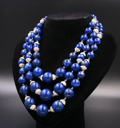 Elegant vintage necklace of blue pearls, imitation lapis lazuli, 3-row climbing, with rhinestone bells. Beautiful closure with blue inlay and rhinestones. Jewel of beautiful workmanship in good vintage condition. Made in Italy Length on the first lap 45.5 cm. International customers: I ship with international registered tracked mail. If you plan to order more than one item, please message me before placing an order, and I can adjust the shipping to reflect the correct weight and cost. Please mak Royal Blue Lapis Lazuli Necklaces With Round Beads, Royal Blue Lapis Lazuli Necklace With Round Beads, Blue Polished Beads Costume Jewelry, Vintage Blue Necklace For Anniversary, Royal Blue Round Beads Necklace For Gift, Blue Gemstone Beads For Gifts, Elegant Blue Beads, Gems, And Cabochons As Gift, Elegant Blue Beads Gems And Cabochons For Gifts, Vintage Blue Polished Beads Jewelry