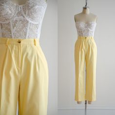 Cheery yellow trousers, with a partial elastic waist, side pockets, and straight legs. ☛ m e a s u r e m e n t s ☚ Best for: S Waist: 26-29 Hips: 39 Rise: 11 Inseam: 27 ☛ d e t a i l s ☚ Era: 1990s Material:cotton, polyester Condition: excellent ☛ v i s i t   t h e   s h o p ☚ https://etsy.me/2Nd23kg ☛ instagram ┇ poppycockvintage ☛ facebook ┇ poppycockvintage Vintage Ankle-length Pants For Spring, Yellow High Waist Cotton Wide Leg Pants, Vintage Wide Leg Yellow Pants, Vintage Wide Leg Yellow Bottoms, Vintage Yellow Wide-leg Bottoms, Contrast Outfit, Yellow Trousers, Gay Outfits, Ankle Trousers