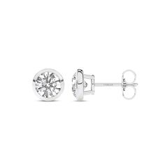 Immerse yourself in the understated beauty of our Round Solitaire Bezel Diamond Studs. Crafted with precision, each earring features a mesmerizing round diamond cradled in a sleek bezel setting. The minimalist design accentuates the lab-grown diamond's brilliance, making these diamond stud earrings a timeless addition to any jewelry collection. Fine Jewelry Round Cut Single Diamond Earrings, Anniversary Diamond Earrings With Tension Setting, Minimalist White Gold Diamond Earrings With Round Cut, White Gold Diamond Round Earrings, Formal White Gold Diamond Earrings With Round Stone, Elegant 14k White Gold Earrings With Single Diamond, Fine Jewelry Single Diamond Round Earrings, Minimalist Diamond Earrings With Bezel Setting For Formal Occasions, Timeless 14k White Gold Diamond Earrings