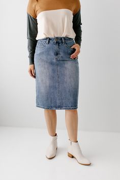 The 'Kyra' is another one of our very own exclusive denim skirts. Designed with everyday wear in mind, this skirt will pair well with just about any casual top in your wardrobe! This denim skirt is 100% cotton and does not have stretch, giving it a vintage vibe we love! Every woman needs a classic, straight denim skirt in her closet and this skirt is an excellent choice! Available in light or vintage wash. 100% Cotton Machine Wash Cold Gentle Cycle Do Not Bleach Hang to Dry Do Not Dry Clean Mode Casual Non-stretch Denim Skirt With Frayed Hem, Medium Wash Cotton Denim Skirt Knee-length, Non-stretch Light Wash Denim Skirt With Pockets, Relaxed Denim Skirt With Pockets, Medium Wash, Knee-length Medium Wash Denim Skirt With Frayed Hem, Denim Skirts Knee Length, Denim Pencil Skirt, Size 10 Models, Gingham Tops