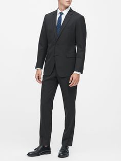 Tailored Suits With Welt Pockets For Business Meetings, Slim Fit Business Outerwear In Suiting Fabric, Business Suit With Concealed Placket In Suiting Fabric, Elegant Slim Fit Blazer For Business Meetings, Modern Fitted Suits For Business, Modern Fitted Business Suits, Modern Suit For Office Made Of Suiting Fabric, Modern Suit For Office, Modern Suit In Suiting Fabric For Office