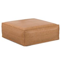 a square footstool made out of brown suede leather, on a white background