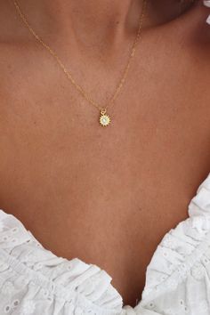 Gold Sun Necklace | Gold Necklace | Sunshine Necklace | Minimalist Necklace | Dainty Necklace | Delicate Necklace | Simple Gold Necklace DETAILS: * PENDANT is Gold Plated with a Cubic Zirconia, measuring 9mm * CHAIN is 14k Gold Filled * CLASP is 14k Gold Filled Model is wearing a 16 inch chain GOLD PLATED CARE: * Always remove jewelry before swimming, bathing, doing household chores, or using abrasive cleaners. * Apply beauty products such as perfume, hairspray or deodorant before wearing jewelr Gold Necklace Delicate, Gold Sun Necklace, Small Gold Necklace, Simple Gold Necklace, Necklace Minimalist Jewelry, Sunshine Necklace, Dainty Gold Jewelry, Delicate Gold Necklace, Pretty Jewelry Necklaces