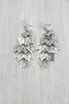 100% nickel free.Material:silver plating.Free gift wrapping.Free shipping on all orders and easy return.30 day return policy. Silver Earrings With Butterfly Charm, Nickel-free Silver Butterfly Earrings, Nickel-free Butterfly Shaped Silver Earrings, Silver Butterfly Charm Drop Earrings, Silver Butterfly Charm Earrings For Gifts, Silver Butterfly Charm Earrings, Silver Earrings With Butterfly Charm For Gift, Silver Drop Earrings With Butterfly Charm, Elegant Metal Earrings With Butterfly Charm