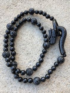 Vintage Translucent Natural Black Jadeite Jade Carved Dragon Clasp Bead Necklace ....Total of weights 92.1grams...Measure 23'' Length With 60 Beads Black Jade 8 to 12MM ...It's in very good condition. Obsidian Necklace With Black Round Beads, Obsidian Necklace With Round Black Beads, Onyx Bead Necklaces With 8mm Round Beads, Onyx Bead Necklace With 8mm Round Beads, Black Single Strand Spiritual Beaded Necklace, Black Spiritual Single Strand Beaded Necklace, Onyx Necklace With 8mm Round Beads, Black Beaded Agate Jewelry, Black Hand-strung Beads For Jewelry Making