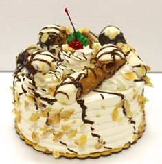 a cake with white frosting and chocolate toppings