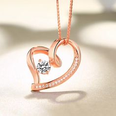 On Valentines Day, there is nothing more meaningful than a heart pendant with a birthstone. It is a truly great gift to express your love to your dearest one. The necklace is made of .925 sterling silver with a gem on the middle which can be personalized with a birthstone of your choosing. The Love In Your Heart Personalized Pendant Necklace arrives with a velvet jeweler's pouch and presentation box, perfect for safekeeping or gift giving. Celebrate the eternal nature of true love with this excl Elegant Gemstone Heart Necklace For Anniversary, Heart-shaped Birthstone Necklace As Gift For Her, Elegant Heart Necklace With Birthstone And Cubic Zirconia, Elegant Cubic Zirconia Heart Necklace With Birthstone, Fine Jewelry Birthstone Necklace With Clavicle Chain For Anniversary, Elegant Heart Necklace With Birthstone In Cubic Zirconia, Heart-shaped Cubic Zirconia Birthstone Necklace, Heart Cut Cubic Zirconia Necklace Gift, Heart-shaped Birthstone Necklace In Cubic Zirconia